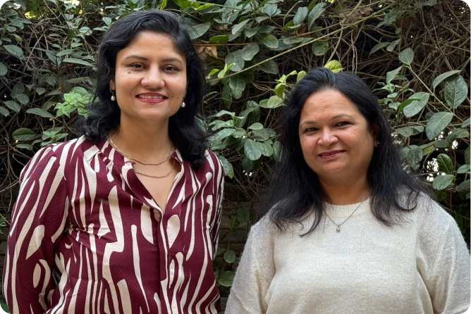 Deepika Jain and Rama Agarwal, the two co-founders of CTutor, standing outdoors among greenery