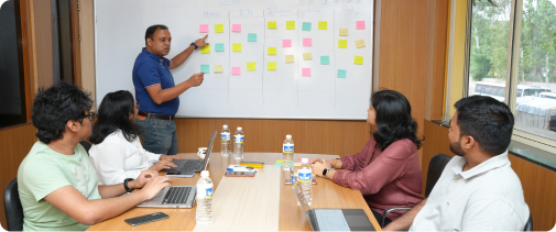 CTutor team planning with sticky notes on a whiteboard during a meeting